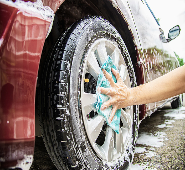 Exterior auto wash with soap on the car.